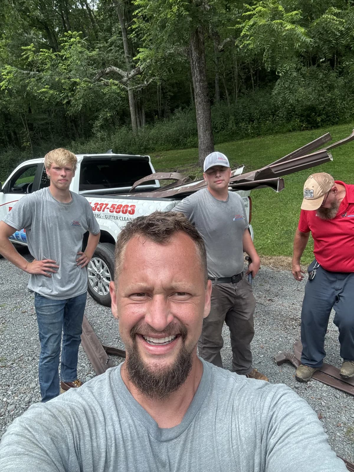 The Flag Gutter crew with the company truck between jobs in Southern West Virginia